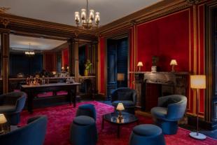 The Scott Hotel lounge, red walls, white ceiling dining tables ands and chairs